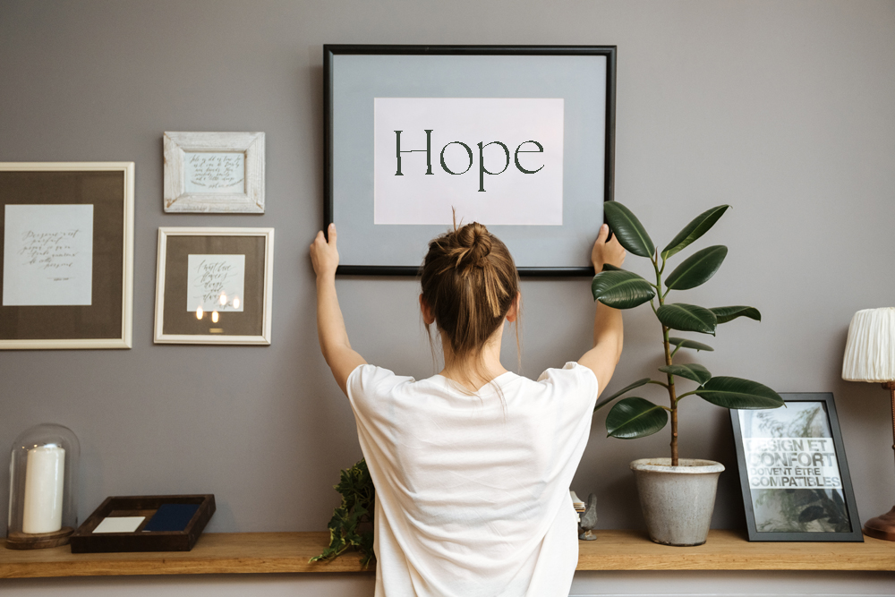 Image is of Amanda Reynolds the counsellor at ARC counselling services. She is sat in her counselling room smiling at the camera. This is in the room where she meets clients on a face-to-face basis for counselling sessions.